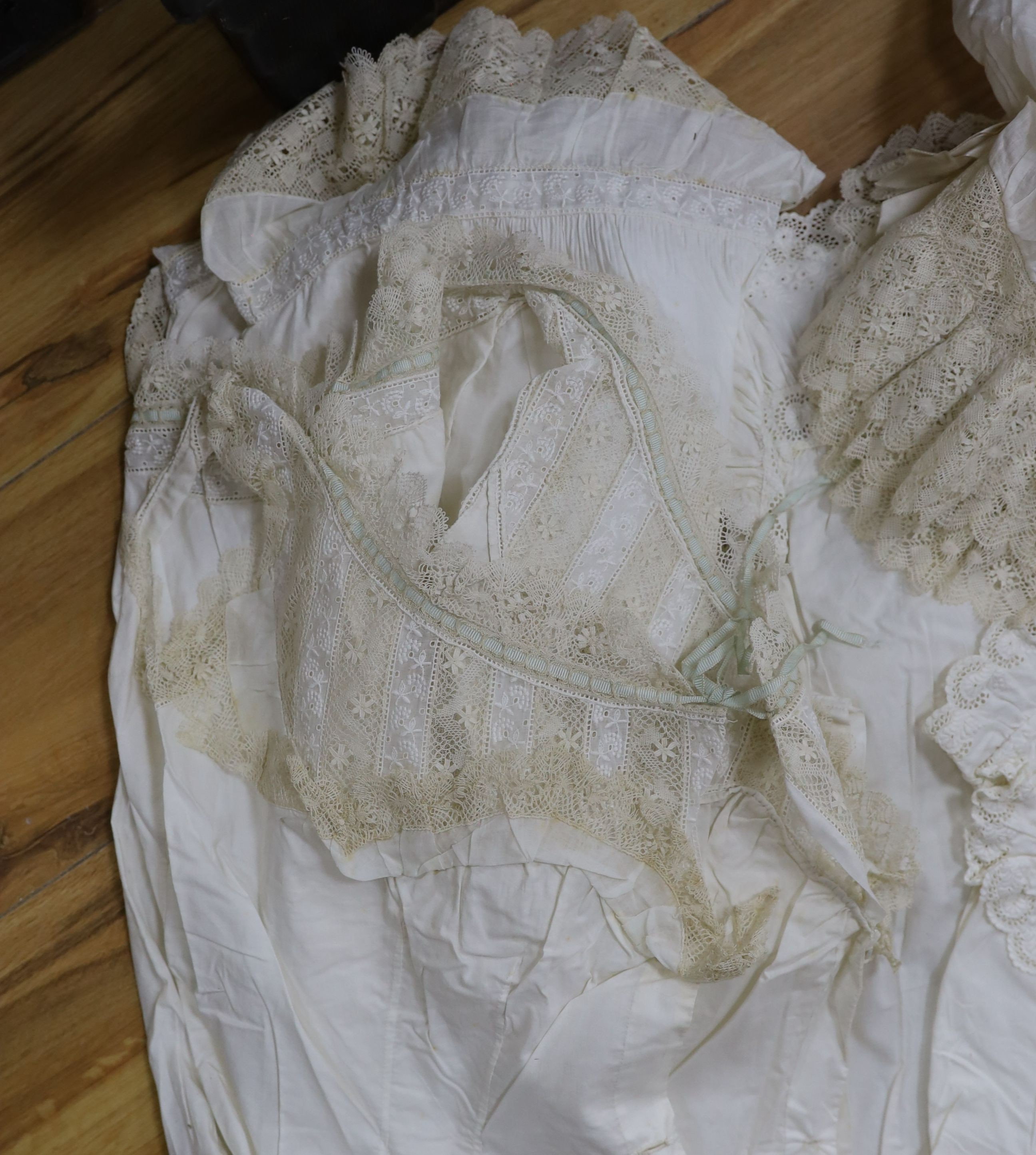 A collection of chemise/pantaloon lace inserted undergarments and a collection of petticoat flounces